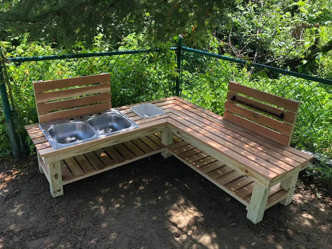 Outdoor cedar mud kitchen built for a preschool.