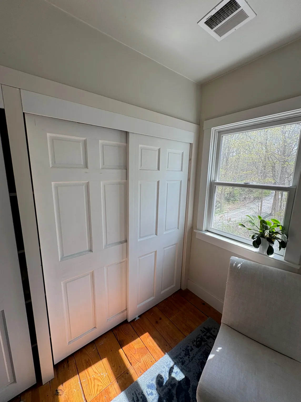 Newly installed sliding closet doors with clean trim.